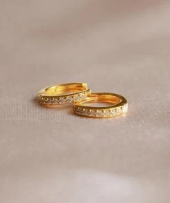 Astridandmiyu Birthstone Earrings April Birthstone Huggies In Gold With Clear CZ