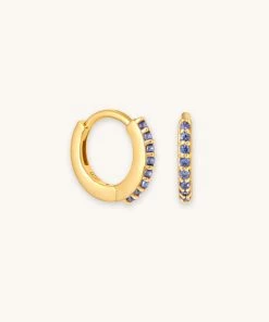 Astrid & Miyu December Birthstone Huggies In Gold With Tanzanite CZ
