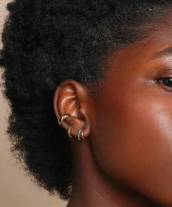 Astrid & Miyu Duo Emerald Huggies In Gold