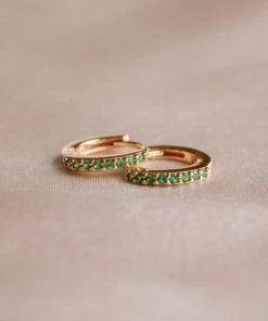 Astridandmiyu Best Sellers May Birthstone Huggies In Gold With Emerald CZ 10 Astridandmiyu Best Sellers May Birthstone Huggies In Gold With Emerald CZ