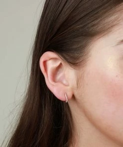 Astrid & Miyu Wave Crystal Huggies In Rose Gold