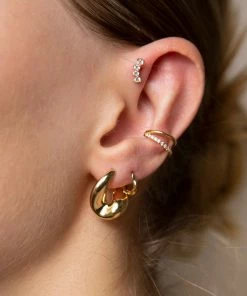 Astridandmiyu Curved Crystal Barbell In Gold Earrings