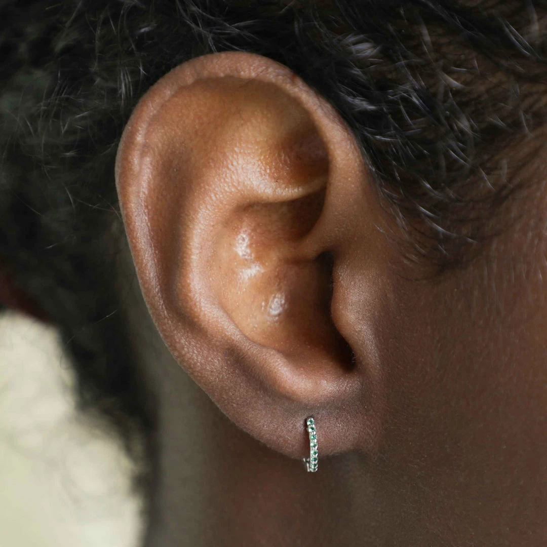 Astridandmiyu May Birthstone Huggies In Silver With Emerald CZ 6 Astridandmiyu May Birthstone Huggies In Silver With Emerald CZ