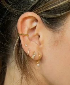 Astridandmiyu Birthstone Earrings April Birthstone Huggies In Gold With Clear CZ